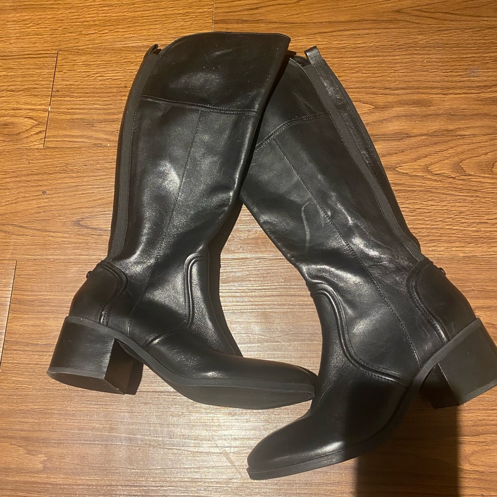 Tall black leather boots.